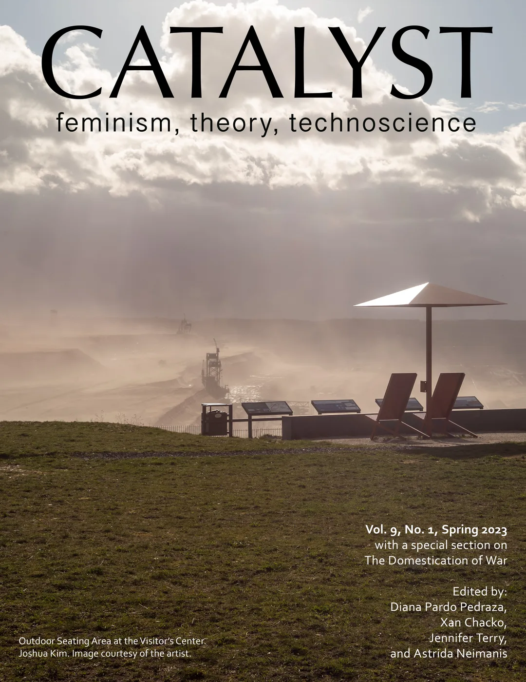 The cover of an issue of Catalyst journal which shows beach chairs and an umbrella overlooking a large industrial quarry